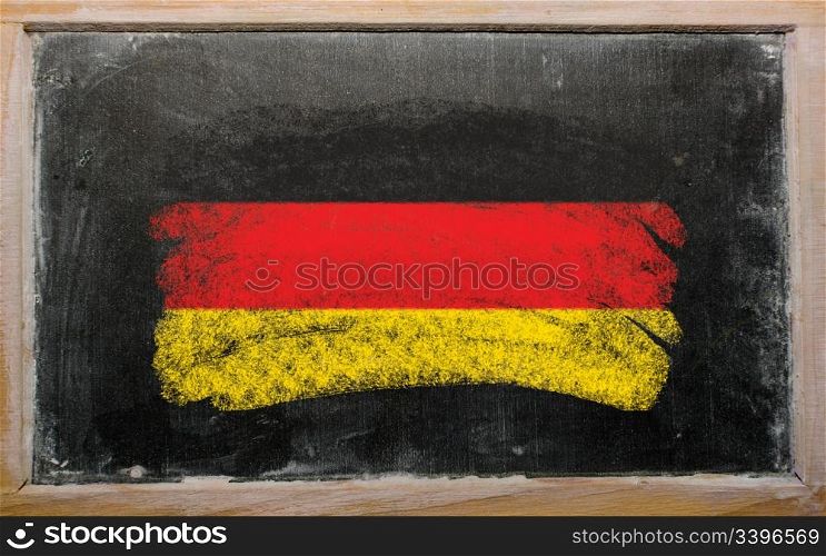 Chalky german flag painted with color chalk on old blackboard