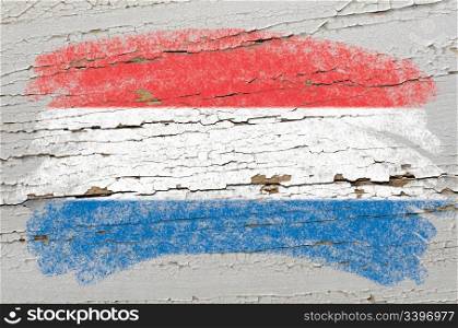 Chalky holland dutch flag painted with color chalk on grunge wooden texture