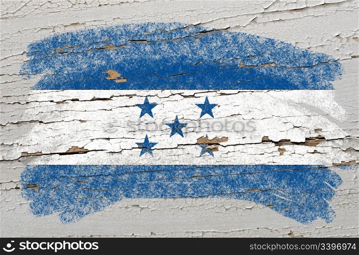 Chalky honduras flag painted with color chalk on grunge wooden texture