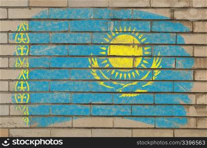 Chalky kazakstan flag painted with color chalk on grunge old brick wall