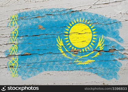 Chalky kazakstan flag painted with color chalk on grunge wooden texture