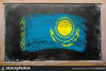 Chalky kazakstan flag painted with color chalk on old blackboard