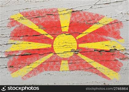 Chalky macedonian flag painted with color chalk on grunge wooden texture