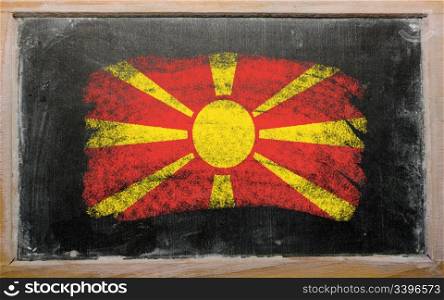 Chalky macedonian flag painted with color chalk on old blackboard