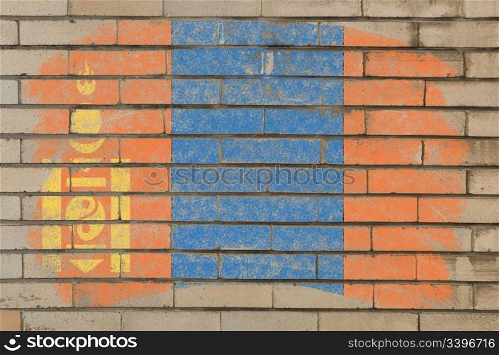Chalky mongolian flag painted with color chalk on grunge old brick wall
