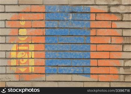 Chalky mongolian flag painted with color chalk on grunge old brick wall