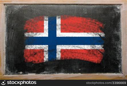 Chalky norwegian flag painted with color chalk on old blackboard