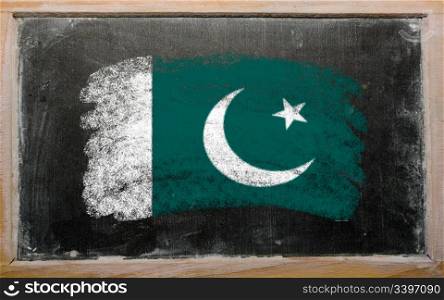 Chalky Pakistan flag painted with color chalk on old blackboard