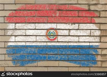 Chalky paraguay flag painted with color chalk on grunge old brick wall