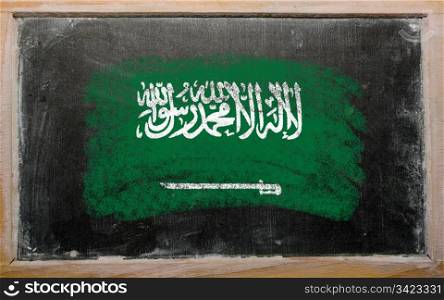 Chalky saudi arabia flag painted with color chalk on old blackboard