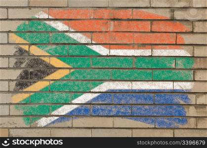 Chalky south african republic flag painted with color chalk on grunge old brick wall
