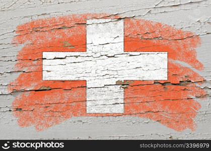 Chalky swiss flag painted with color chalk on grunge wooden texture