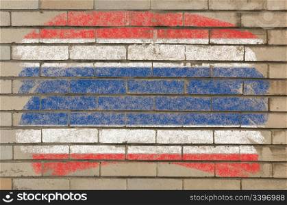 Chalky thai flag painted with color chalk on grunge old brick wall