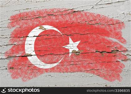 Chalky turkish flag painted with color chalk on grunge wooden texture