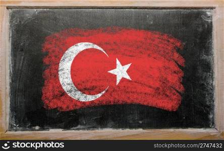 Chalky turkish flag painted with color chalk on old blackboard