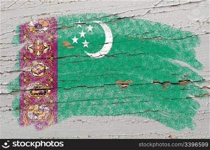 Chalky turkmenistan flag painted with color chalk on grunge wooden texture