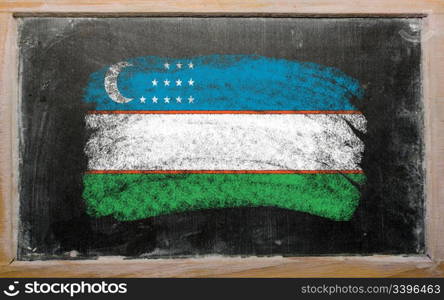 Chalky uzbekistan flag painted with color chalk on old blackboard