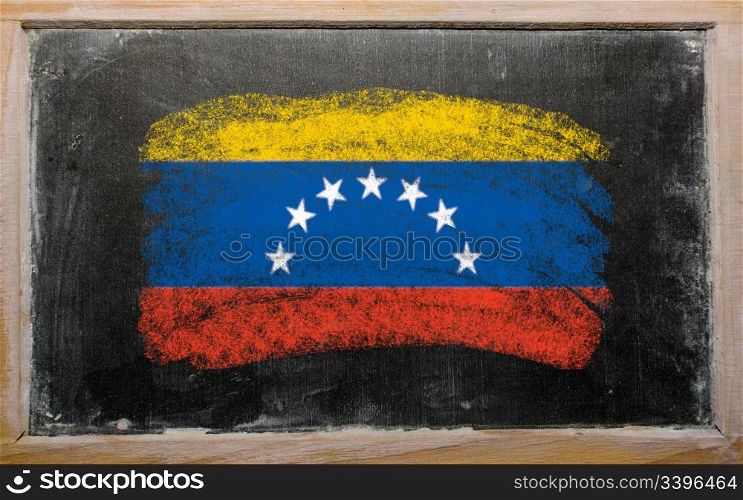 Chalky venezuelan flag painted with color chalk on old blackboard