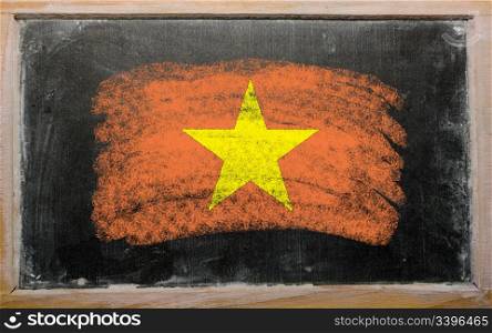 Chalky vietnamese flag painted with color chalk on old blackboard