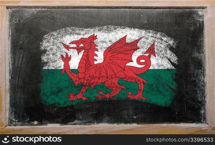 Chalky welsh flag painted with color chalk on old blackboard