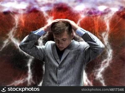 Challenge in business. Frustrated businessman protecting his head with arms