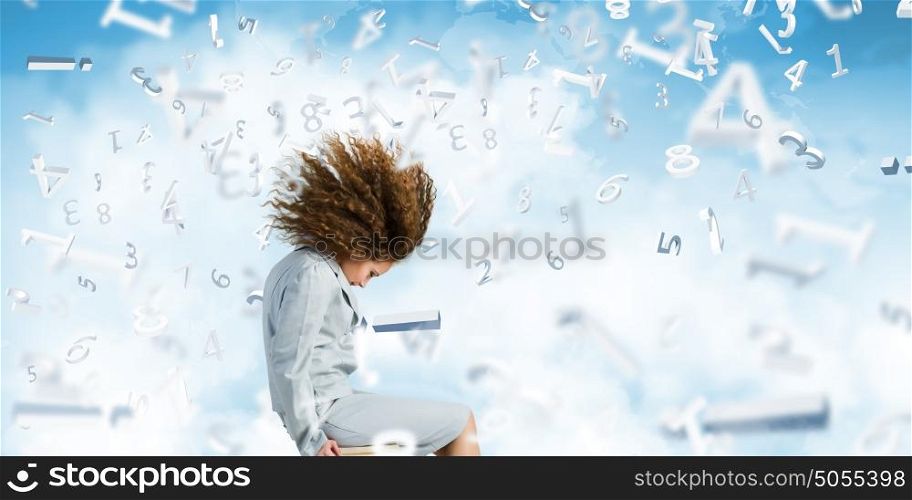 Challenge in business. Young businesswoman with waving hair sitting on chair