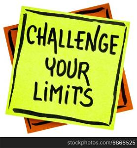 challenge your limits inspirational advice or reminder - handwriting in black ink on an isolated sticky note