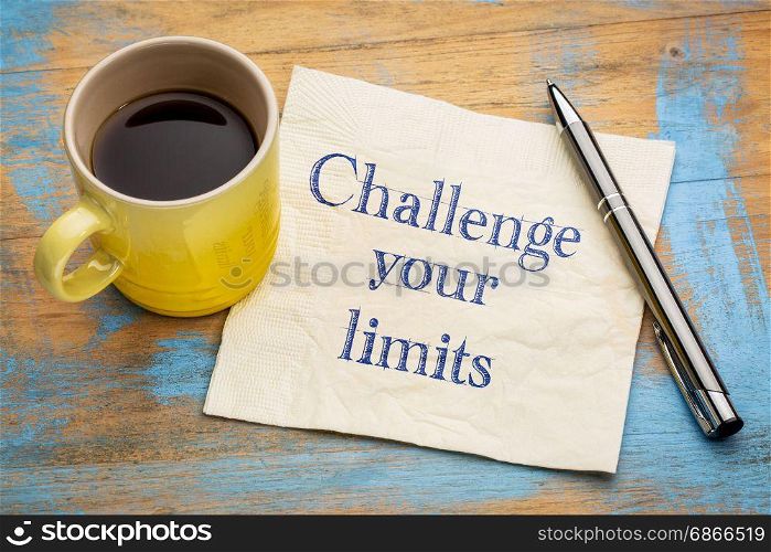 Challenge your limits motivational advice or reminder - handwriting on a napkin with a cup of espresso coffee