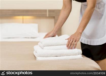 chambermaid preparing hotel room