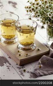 chamomile tea cups wooden board