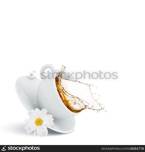 Chamomile tea. White cup of tea with chamomile flower