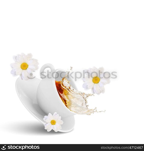 Chamomile tea. White cup of tea with chamomile flower