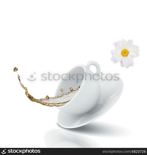 Chamomile tea. White cup of tea with chamomile flower