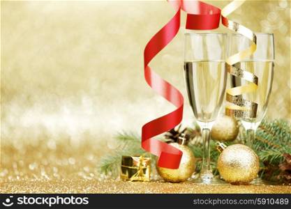 Champagne and christmas decor on glitter background