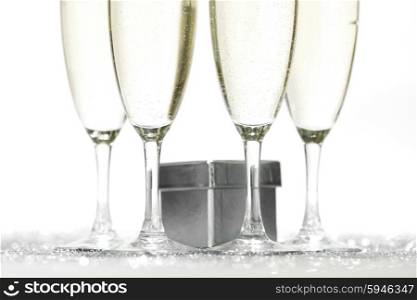 Champagne and gift isolated on white background