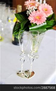 champagne and pink gerbera on table in wedding day