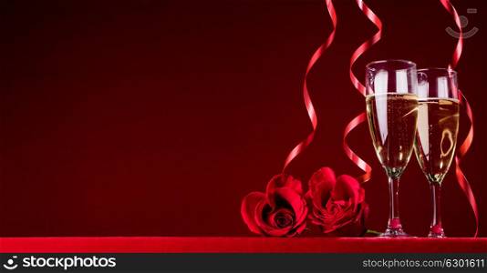 Champagne and roses. Champagne and heart shaped roses with copy space