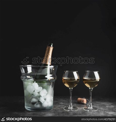 champagne bottle with glasses table