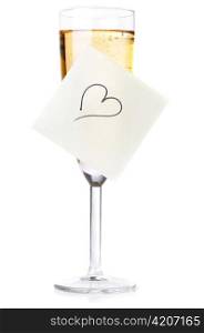 champagne glass with heart on sticky note isolated on white