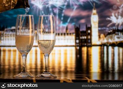 champagne glasses and Big Ben in background New Year&rsquo;s eve in London