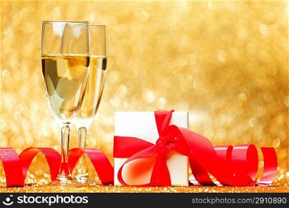 Champagne glasses and gift