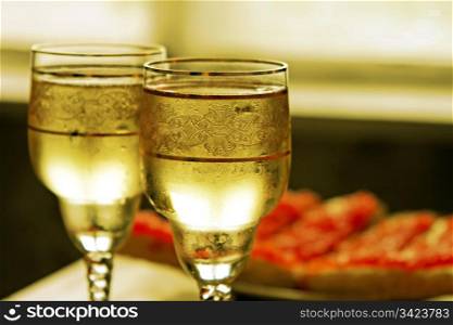 champagne glasses and toasts with red caviar