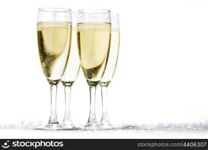 Champagne glasses on light bokeh background