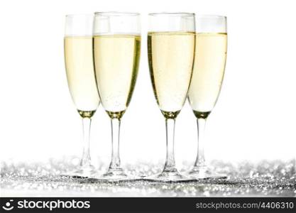 Champagne glasses on light bokeh background