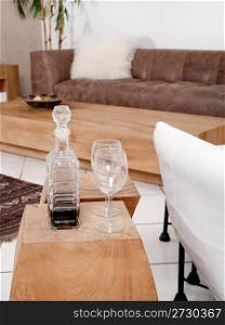 Champagne glasses with modern couch in background, luxurious living-room