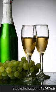 champagne grape and green bottle