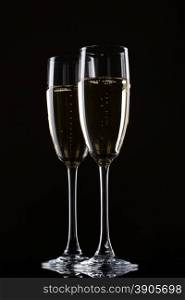 Champagne in glass isolated on a black background