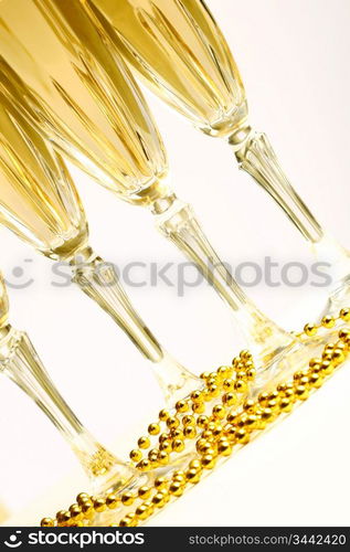 champagne in glasses on white background