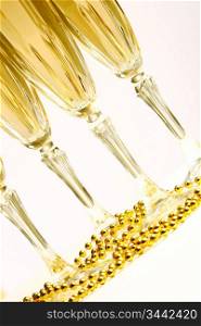 champagne in glasses on white background