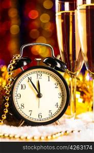 champagne with clock on blurred background